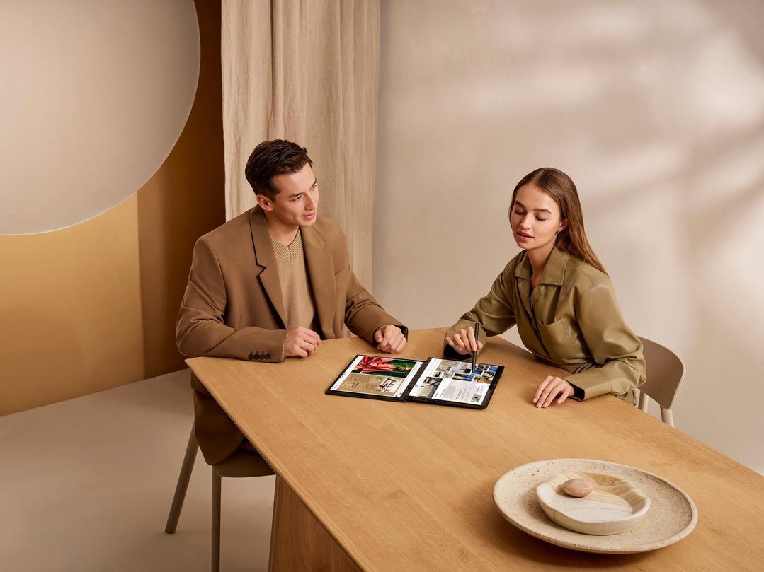 A person and person sitting at a table Description automatically generated